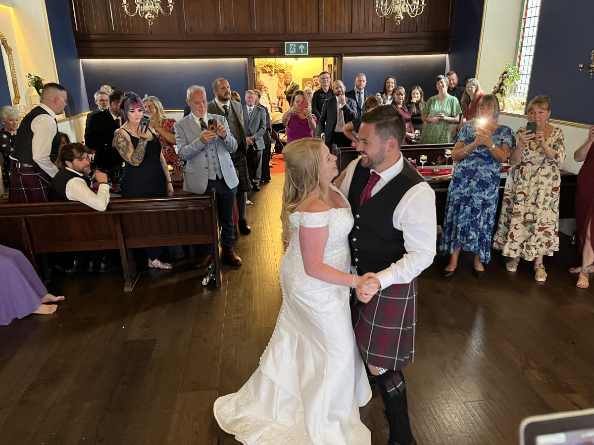 Premier disco weddings bride and groom sharing their first dance at the harbour chapel dunbar
